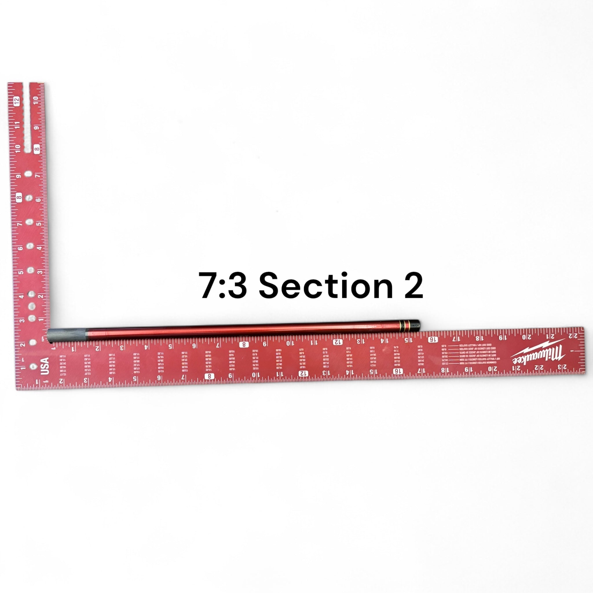 Image of the Akai Samurai Tenkara Rod’s Section 2 with 7:3 action, laid next to a red Milwaukee ruler for scale on a white background, labeled for identification.