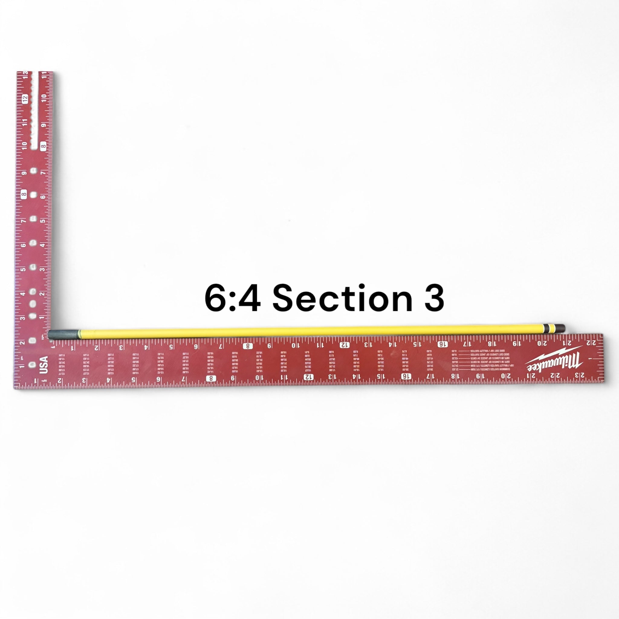 Section 3 of the Middle Fork 6:4 Tenkara Rod by Wasatch Tenkara Rods, displayed alongside a red measuring square for scale. The section features the rod’s yellow carbon fiber finish with brown accent bands.