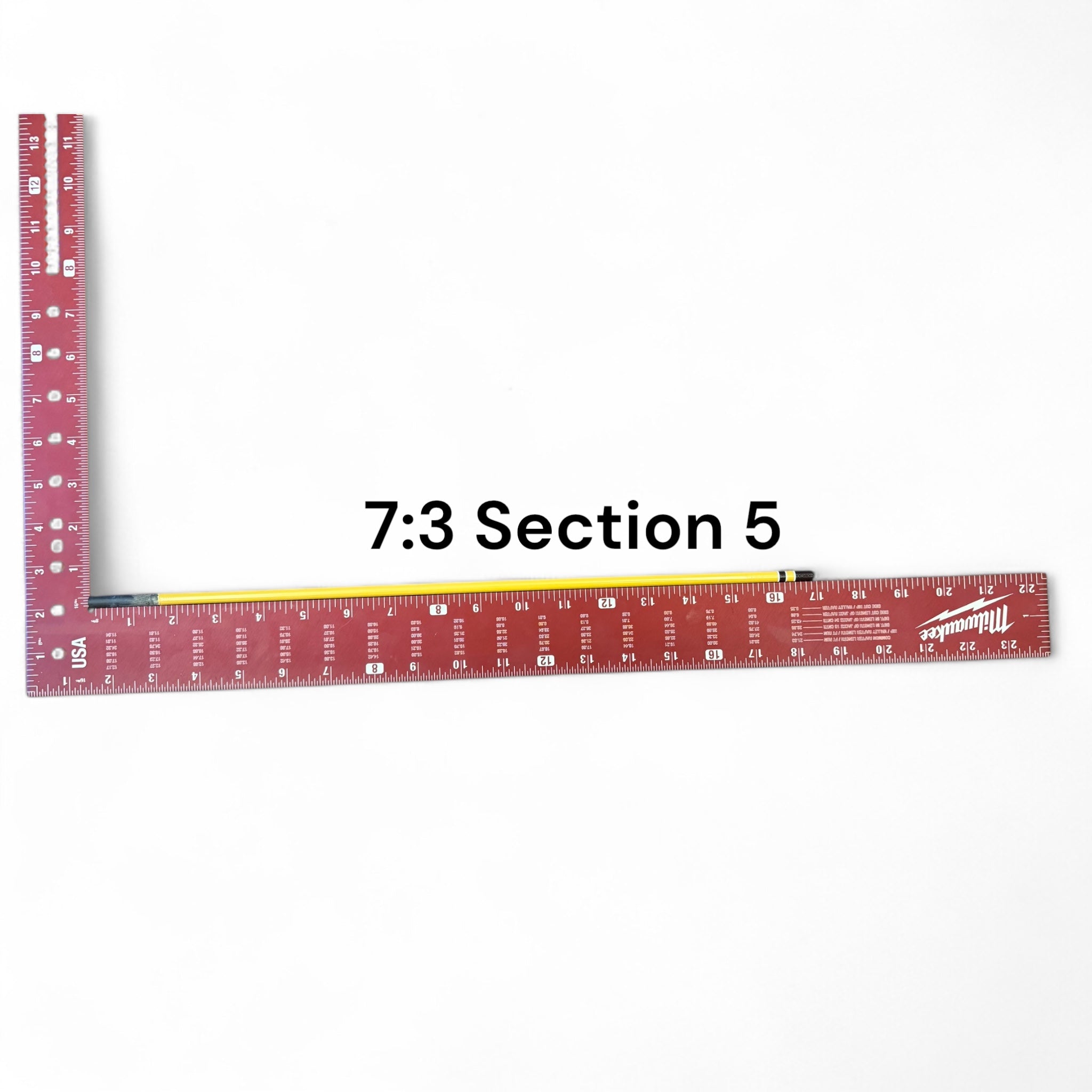 Section 5 of the Middle Fork 7:3 Tenkara Rod by Wasatch Tenkara Rods, displayed with a red measuring square for scale. The rod features yellow carbon fiber construction with brown accent bands.