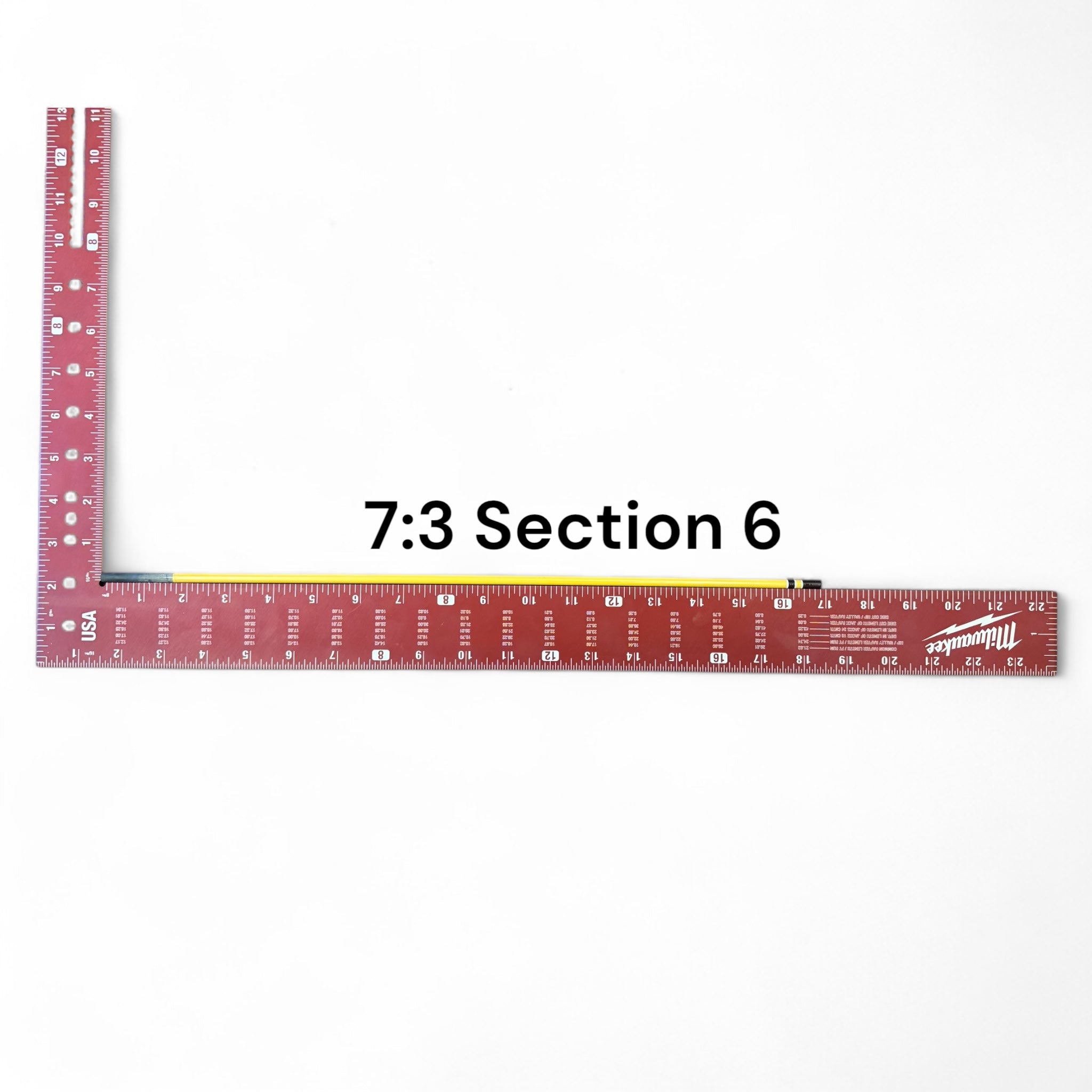 Section 6 of the Middle Fork 7:3 Tenkara Rod by Wasatch Tenkara Rods, displayed with a red measuring square for scale. The rod features yellow carbon fiber construction with brown accent bands.