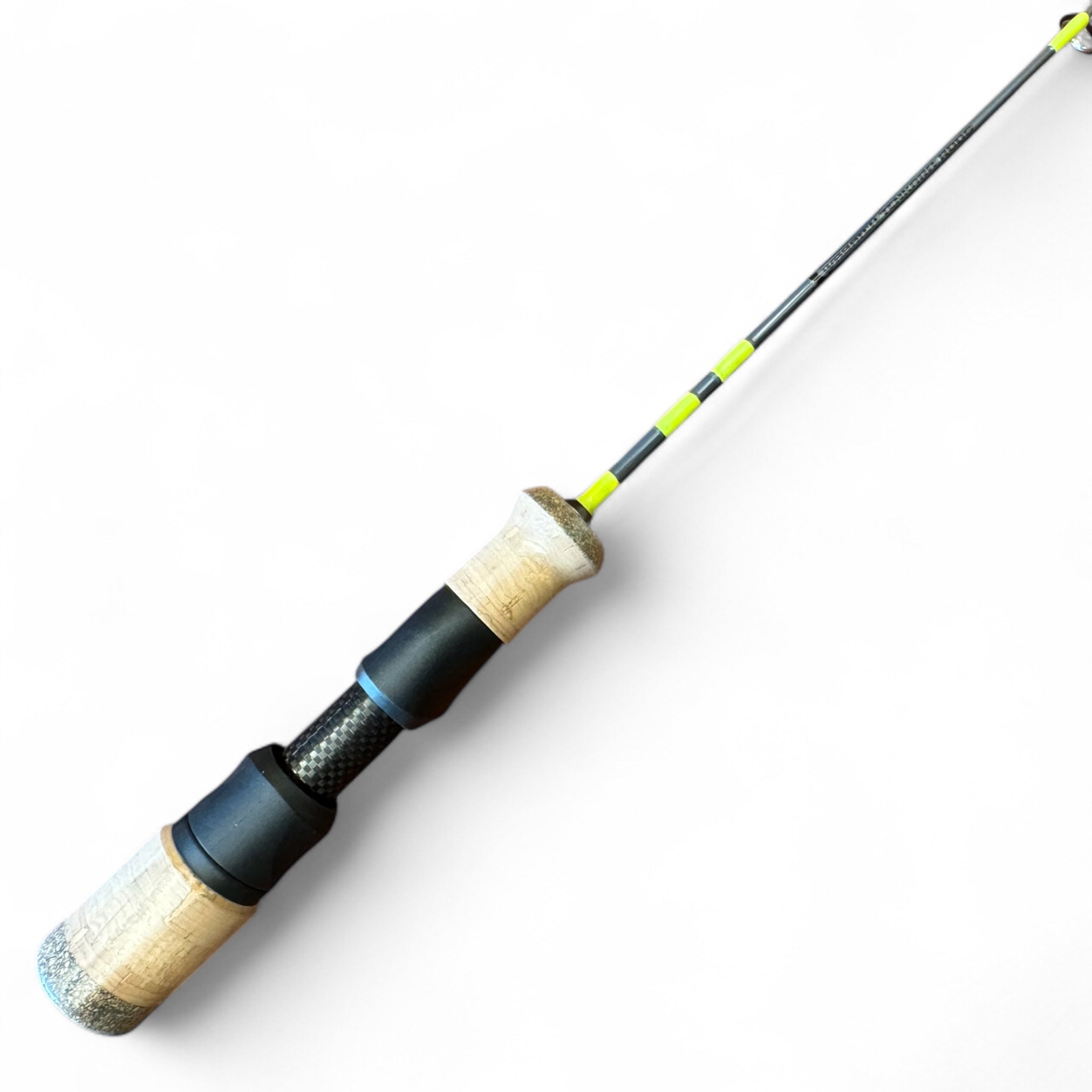 Close-up of the Wasatch Tenkara Rods ice fishing rod handle featuring ergonomic cork grips, a carbon fiber insert, and vibrant green thread wraps for visibility and style.
