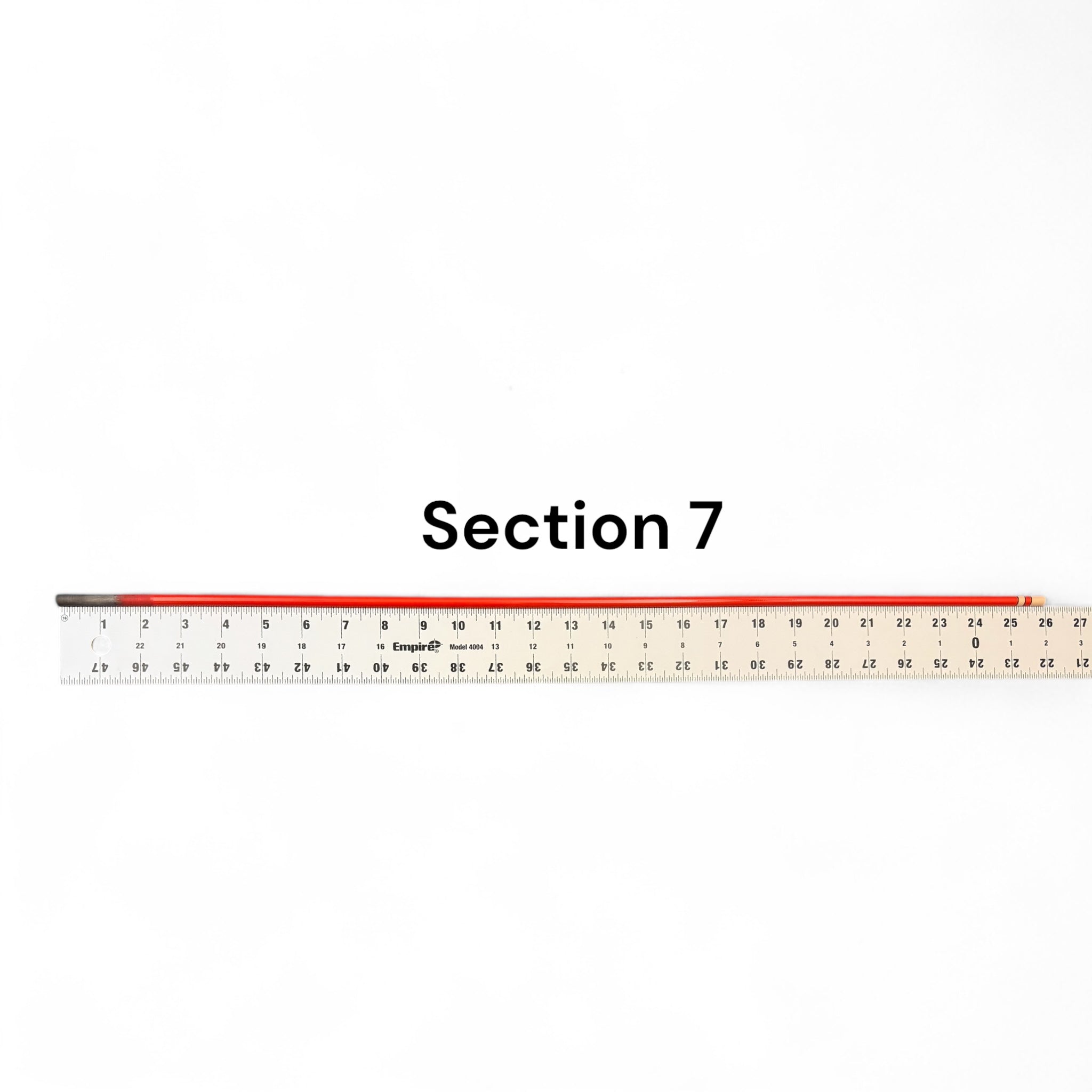 Section 7 replacement segment for Phoenix Rising Tenkara rod by Wasatch Tenkara Rods, shown with ruler for length reference. Durable red carbon fiber construction for precision and performance.