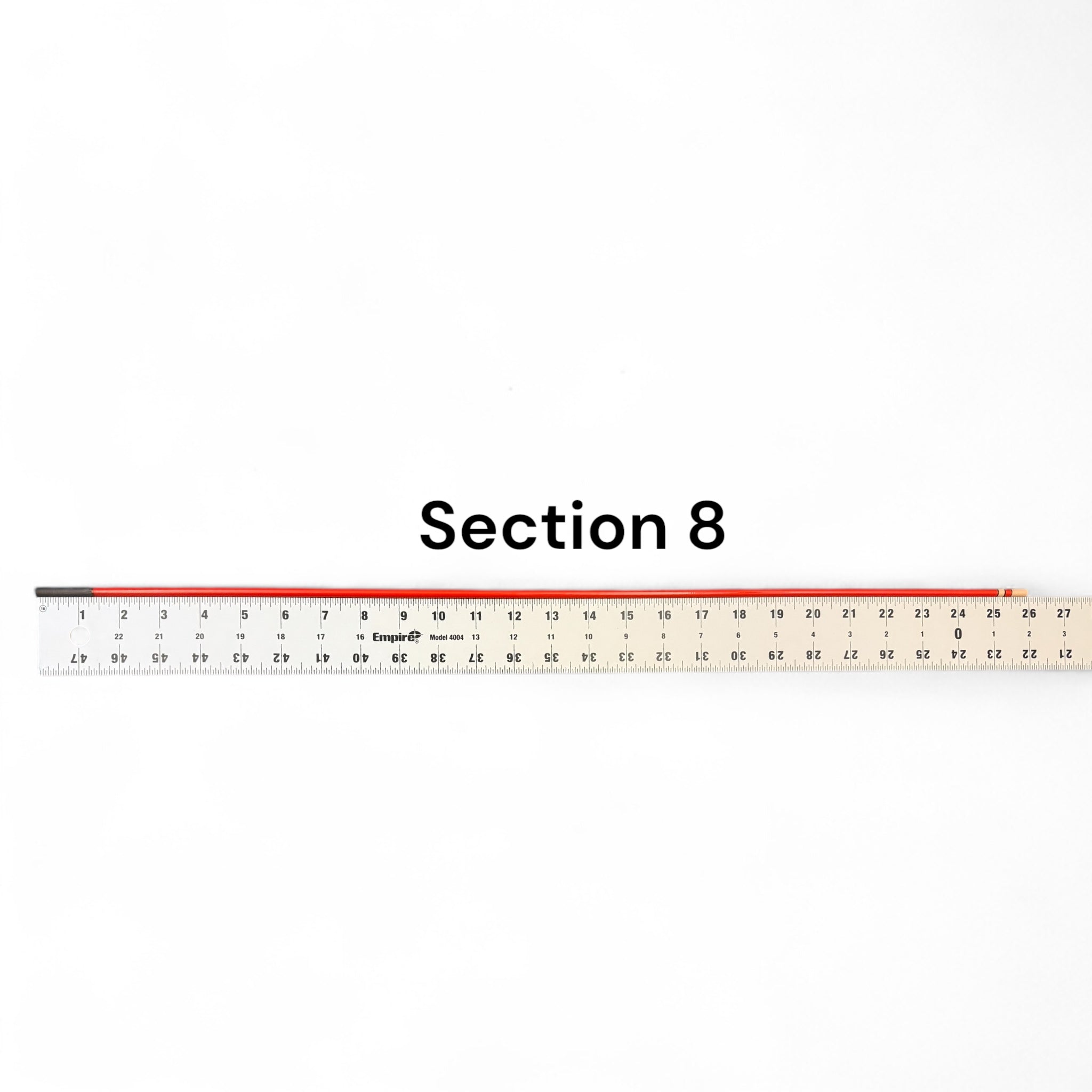 Section 8 replacement segment for Phoenix Rising Tenkara rod by Wasatch Tenkara Rods, shown with ruler for length reference. Durable red carbon fiber construction for precision and performance.