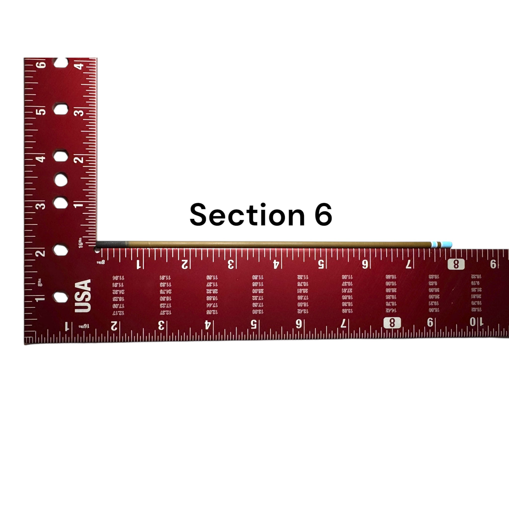 Section 6 of the Wasatch Tenkara Rods Snub Nose IV placed against a red measuring square for size reference, showing custom color banding and precision fit design for modular rod construction.