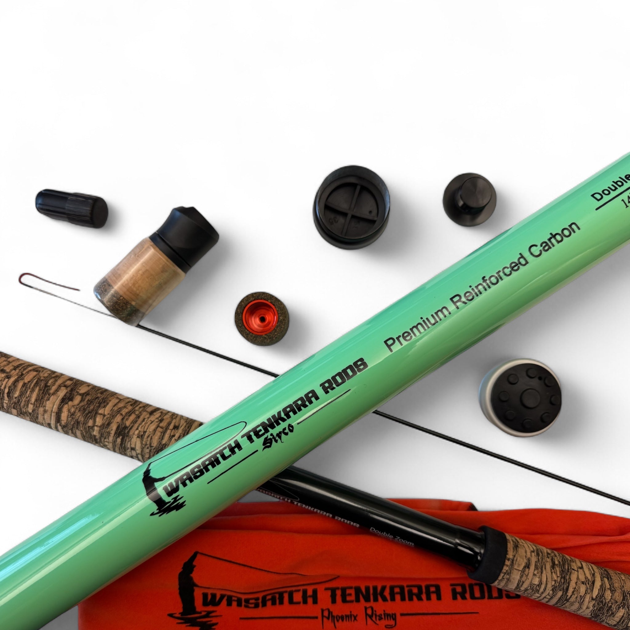 Close-up of Wasatch Tenkara Rods Siyco and Phoenix Rising showing premium rod components including tip sections, butt caps, rod tube, and cork grips, optimized for high-performance Tenkara fishing.
