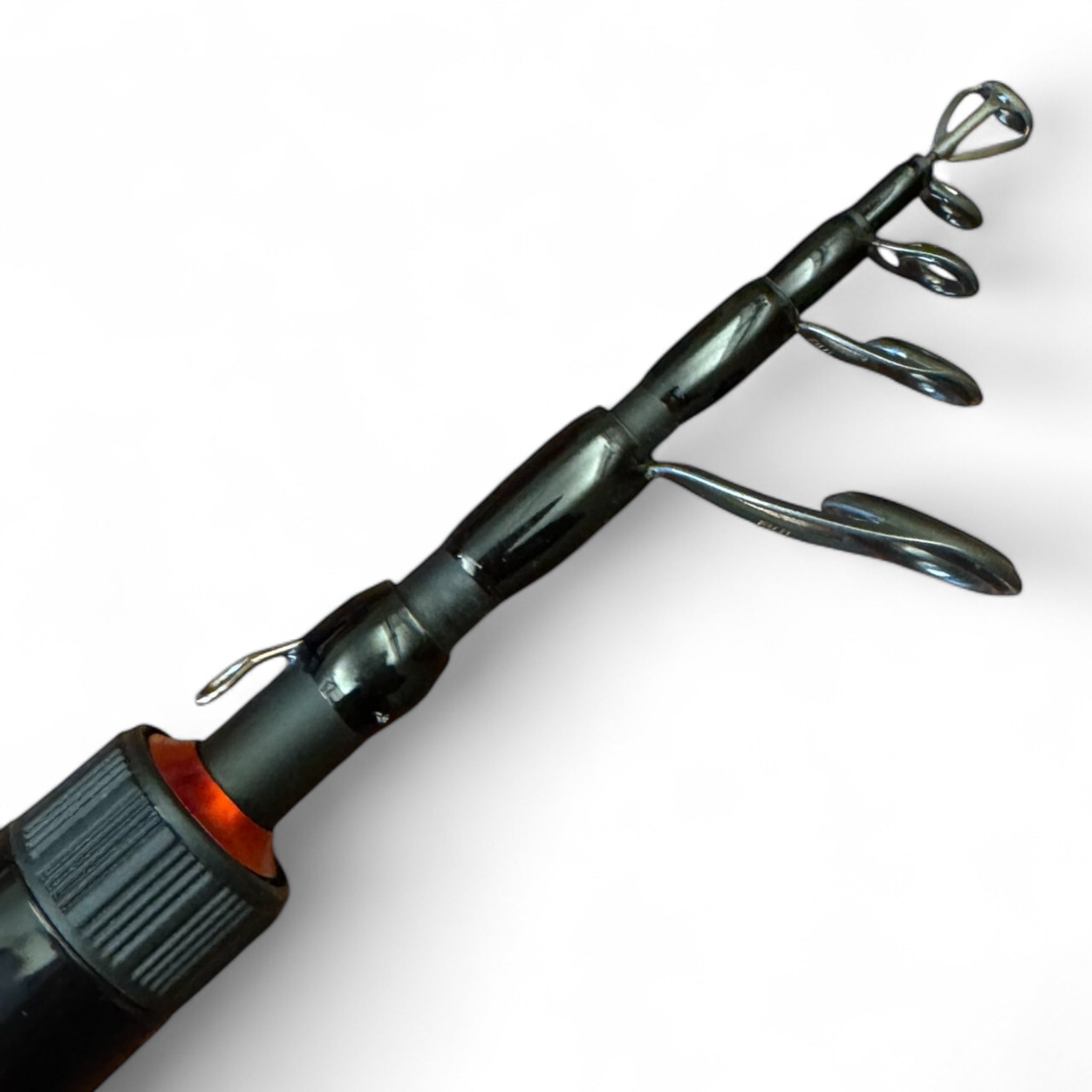 Detailed close-up of the Wasatch Tenkara Rods Command Force spin rod tip, showcasing the telescopic segments and durable Fuji-style line guides for smooth casting and optimal performance in freshwater fishing.