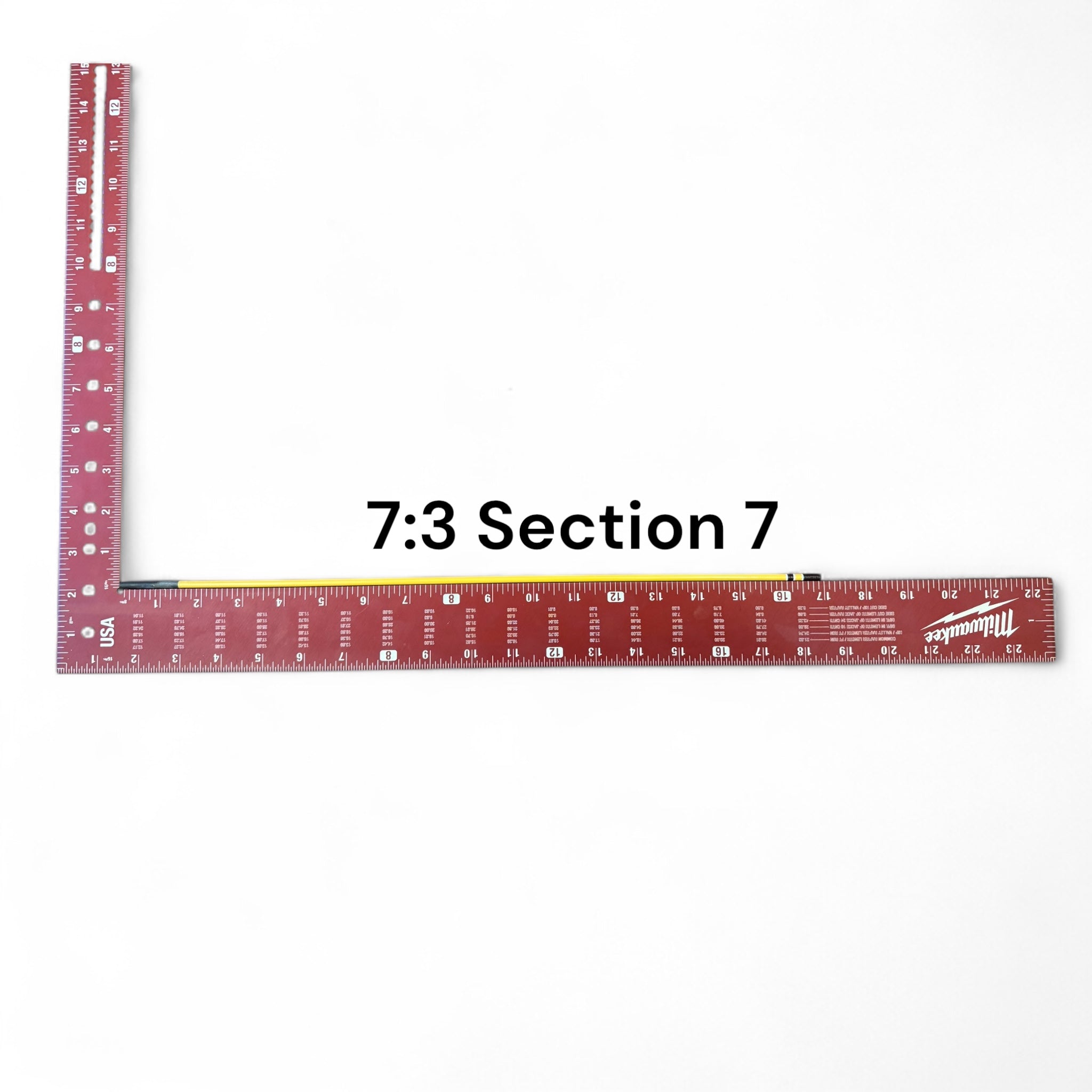 Section 7 of the Middle Fork 7:3 Tenkara Rod by Wasatch Tenkara Rods, displayed with a red measuring square for scale. The rod features yellow carbon fiber construction with brown accent bands.