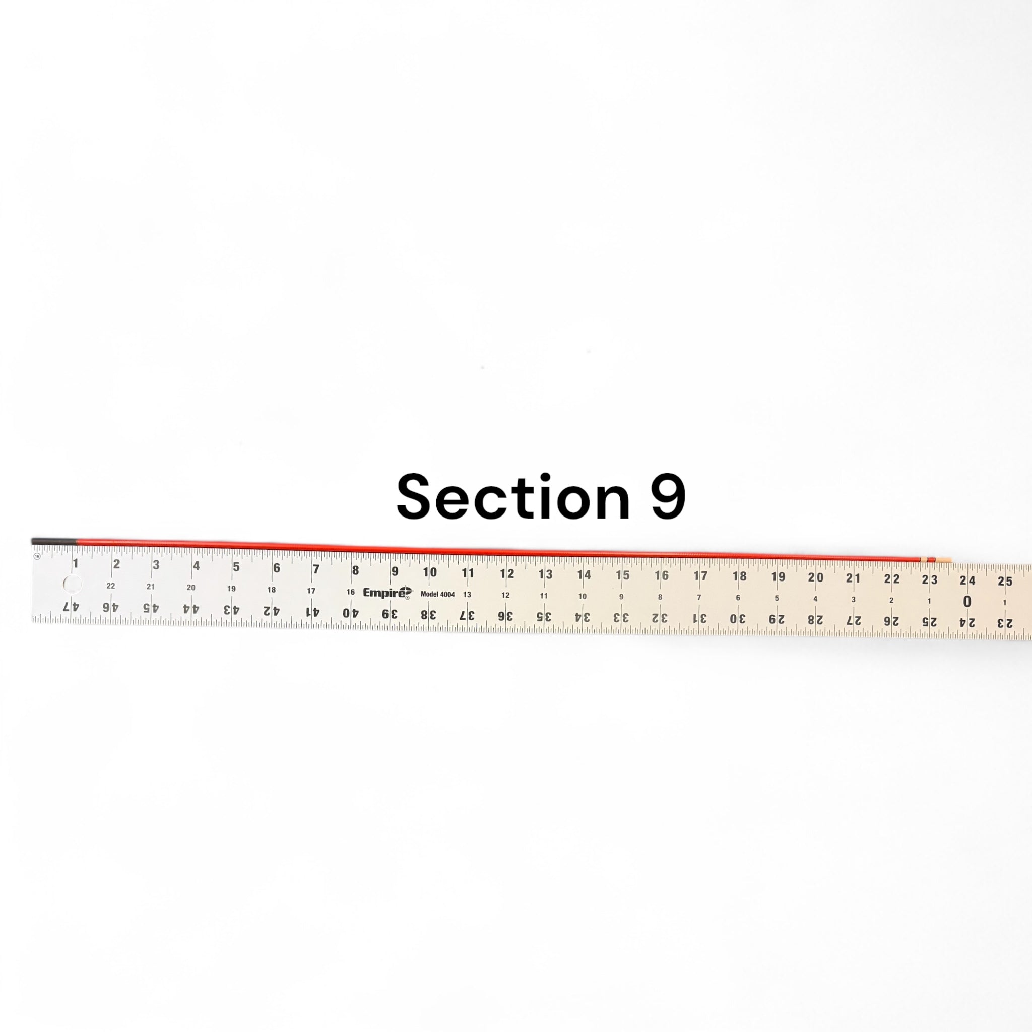 Section 9 replacement segment for Phoenix Rising Tenkara rod by Wasatch Tenkara Rods, shown with ruler for length reference. Durable red carbon fiber construction for precision and performance.