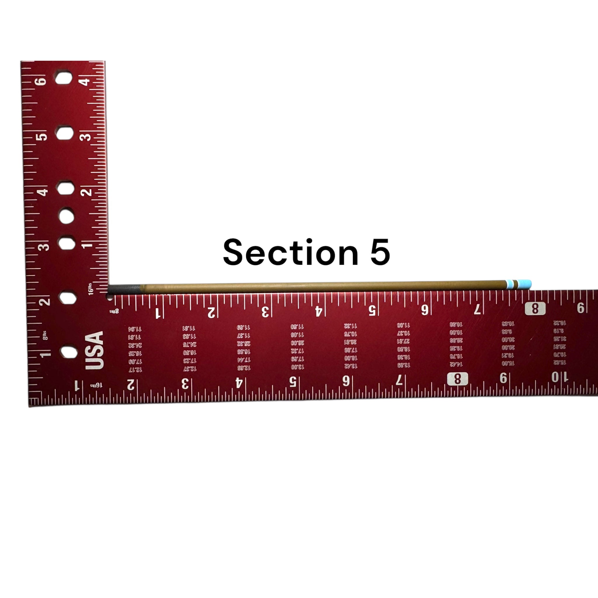 Section 5 of the Wasatch Tenkara Rods Snub Nose IV placed against a red measuring square for size reference, showing custom color banding and precision fit design for modular rod construction.