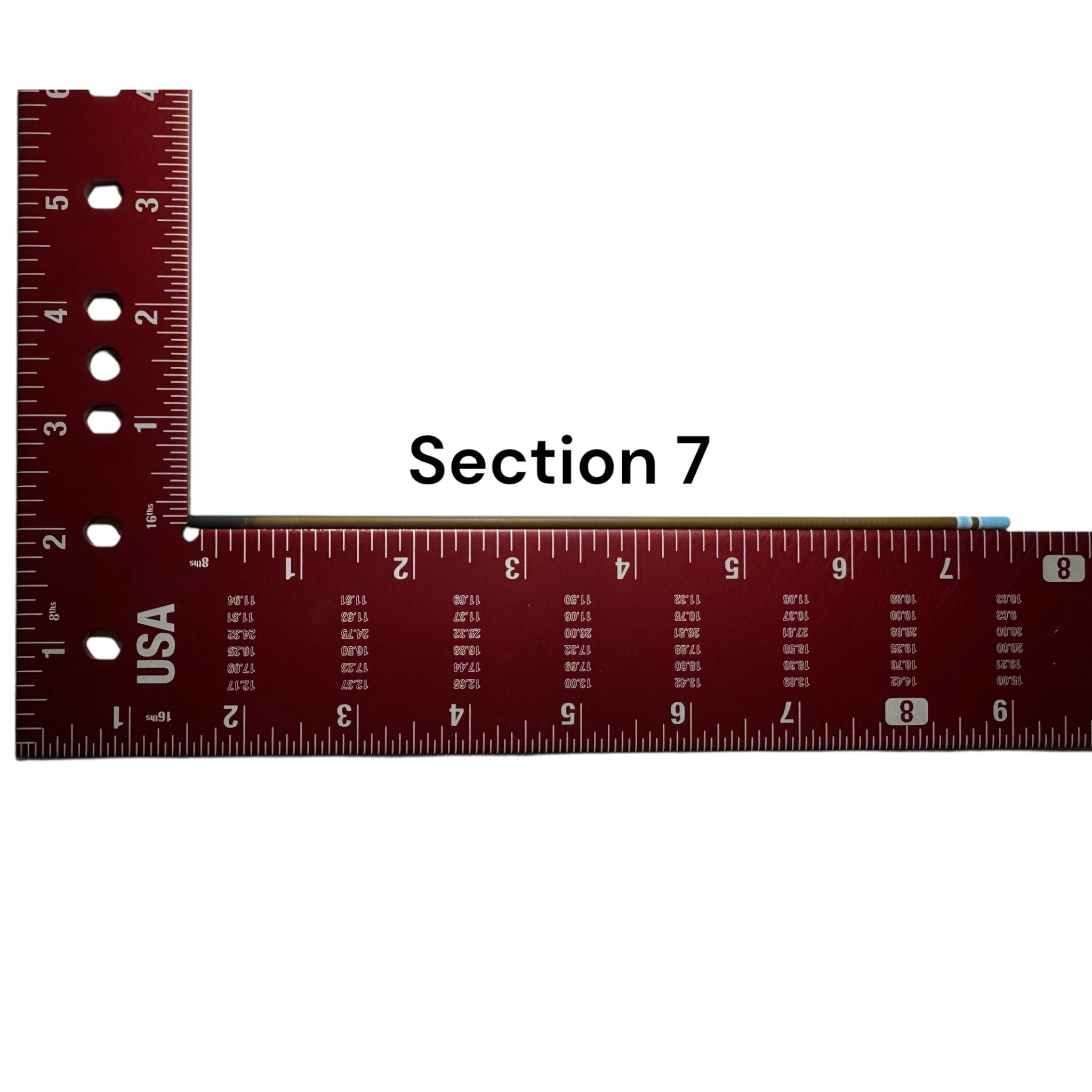 Section 7 of the Wasatch Tenkara Rods Snub Nose IV placed against a red measuring square for size reference, showing custom color banding and precision fit design for modular rod construction.