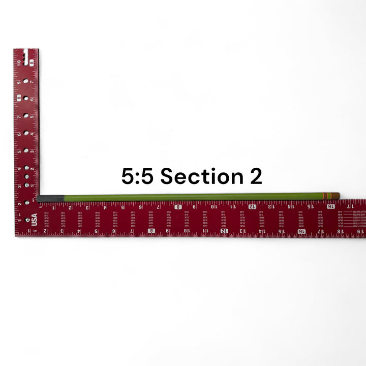 Wasatch Tenkara Rods Baby RodZilla 5:5 Section 2 replacement part shown against a measuring square for scale—green carbon fiber rod segment for ultralight tenkara fly fishing rod repair.