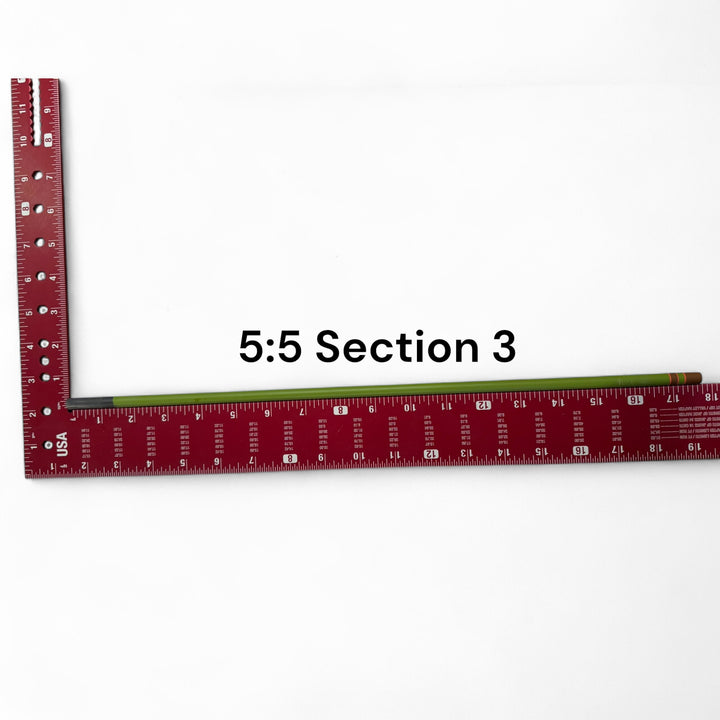 Wasatch Tenkara Rods Baby RodZilla 5:5 Section 3 replacement part shown against a measuring square for scale—green carbon fiber rod segment for ultralight tenkara fly fishing rod repair.