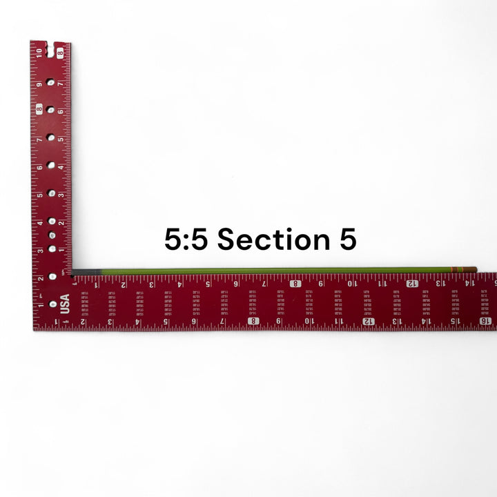 Wasatch Tenkara Rods Baby RodZilla 5:5 Section 5 replacement part shown against a measuring square for scale—green carbon fiber rod segment for ultralight tenkara fly fishing rod repair.