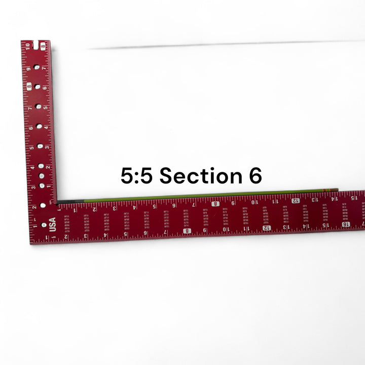 Wasatch Tenkara Rods Baby RodZilla 5:5 Section 6 replacement part shown against a measuring square for scale—green carbon fiber rod segment for ultralight tenkara fly fishing rod repair.