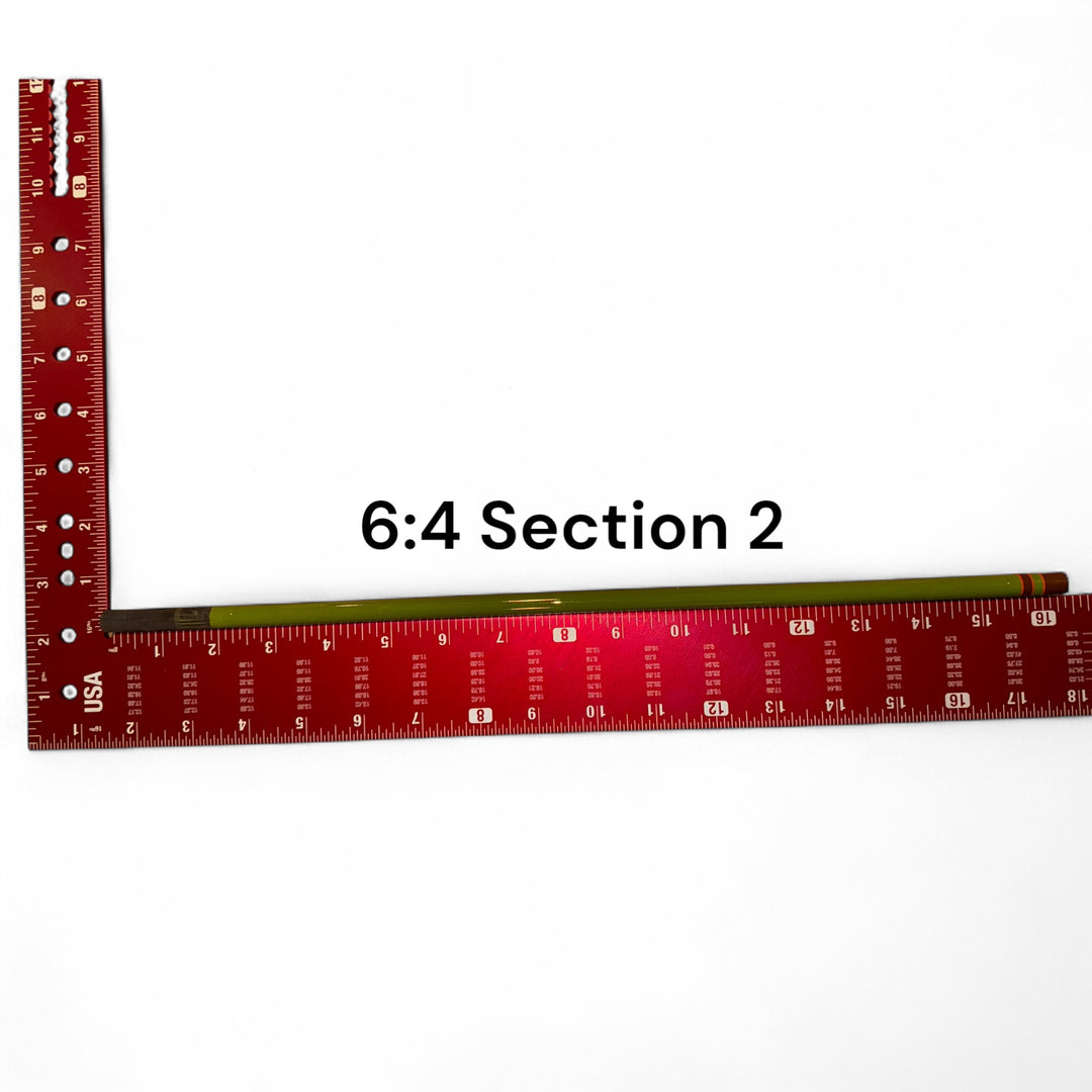 Wasatch Tenkara Rods Baby RodZilla 6:4 Section 2 replacement part shown against a measuring square for scale—green carbon fiber rod segment for ultralight tenkara fly fishing rod repair.