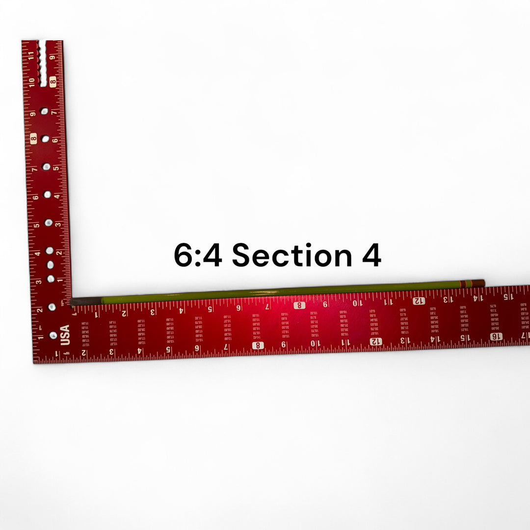 Wasatch Tenkara Rods Baby RodZilla 6:4 Section 4 replacement part shown against a measuring square for scale—green carbon fiber rod segment for ultralight tenkara fly fishing rod repair.