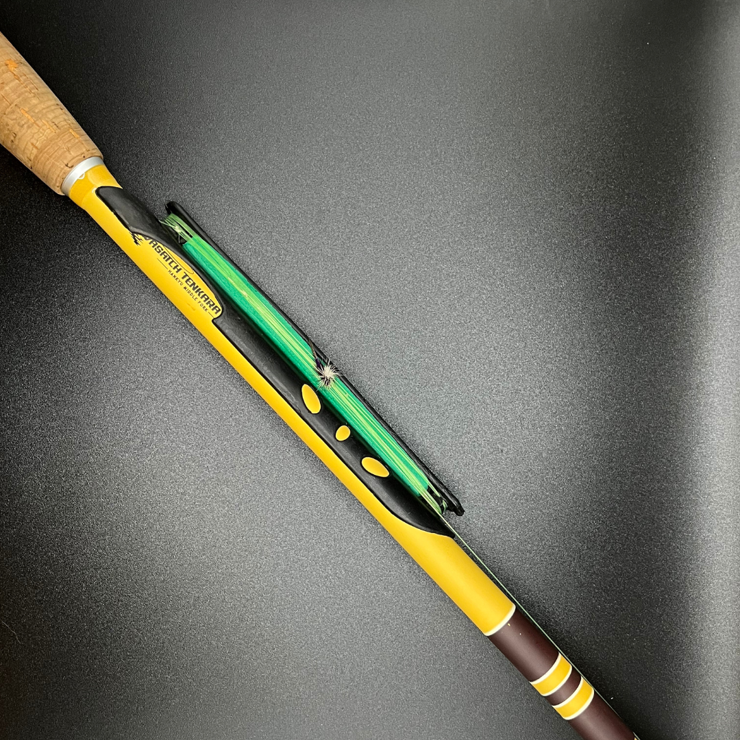 This is a snap on line holder on the Wasatch Tenkara Rods Middle Fork. There is a Purple Parachute Adams on this rod.
